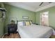 Comfortable bedroom with a large bed and en suite bathroom at 4710 69Th E Ct, Palmetto, FL 34221