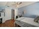 Bedroom with a window, ceiling fan, and wood-look floors at 4710 69Th E Ct, Palmetto, FL 34221