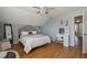 Bedroom with gray walls, hardwood floors, and a vanity with lighted mirror at 4710 69Th E Ct, Palmetto, FL 34221