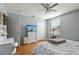 Bedroom with gray walls, hardwood floors, white dresser and double door closet at 4710 69Th E Ct, Palmetto, FL 34221
