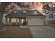 Charming single-Gathering home featuring a spacious front porch and well-manicured lawn at dusk at 4710 69Th E Ct, Palmetto, FL 34221