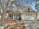 Charming home featuring a well-manicured lawn, front porch, and two car garage at 4710 69Th E Ct, Palmetto, FL 34221
