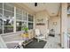 Inviting front porch featuring decorative elements and cozy seating arrangement at 4710 69Th E Ct, Palmetto, FL 34221