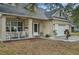 Cozy front porch with seating area, perfect for enjoying the outdoors and welcoming guests at 4710 69Th E Ct, Palmetto, FL 34221
