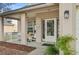 Cozy front porch with seating area and a decorative front door entrance at 4710 69Th E Ct, Palmetto, FL 34221