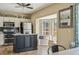 Well-equipped kitchen featuring a central island, stainless steel appliances, and breakfast nook at 4710 69Th E Ct, Palmetto, FL 34221