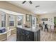 Open floor plan with island, stainless appliances, and eat-in dining area at 4710 69Th E Ct, Palmetto, FL 34221