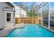 Inviting screened-in pool area with lounge chairs for relaxing and enjoying the outdoors at 4710 69Th E Ct, Palmetto, FL 34221