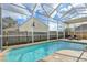 Inviting screened-in pool area with lounge chairs for relaxing and enjoying the outdoors at 4710 69Th E Ct, Palmetto, FL 34221
