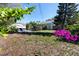 Spacious backyard featuring a concrete patio with outdoor seating, perfect for entertaining or relaxing in a private setting at 4925 16Th N Ave, St Petersburg, FL 33710