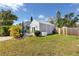 A charming backyard featuring a lush lawn, patio seating, and a storage shed perfect for outdoor living at 4925 16Th N Ave, St Petersburg, FL 33710