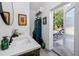 This bathroom has a sink with white countertop and a wooden vanity at 4925 16Th N Ave, St Petersburg, FL 33710