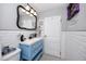 Stylish bathroom with a blue vanity, subway tile walls, and black and white tiled floors at 4925 16Th N Ave, St Petersburg, FL 33710