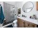 This bathroom features geometric tile in the shower, and a modern vanity and mirror at 4925 16Th N Ave, St Petersburg, FL 33710
