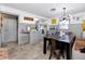 Bright dining area featuring a large table, stylish chandelier, and neutral color scheme at 4925 16Th N Ave, St Petersburg, FL 33710