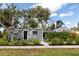 Well-maintained home featuring a tidy front yard, and neutral exterior paint, exuding a sense of suburban charm at 4925 16Th N Ave, St Petersburg, FL 33710
