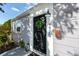 Charming front door with a decorative wreath, a modern house number, and a stylish mailbox at 4925 16Th N Ave, St Petersburg, FL 33710