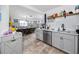 Bright kitchen offering stainless steel appliances, gray cabinets, and a convenient layout to the dining area at 4925 16Th N Ave, St Petersburg, FL 33710