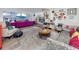 Open living room featuring colorful furnishings and decor, connecting to a modern kitchen at 4925 16Th N Ave, St Petersburg, FL 33710
