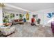 Bright living room with large windows and comfortable furnishings, including gray rug at 4925 16Th N Ave, St Petersburg, FL 33710