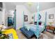 The main bedroom features a four poster bed and an ensuite bathroom at 4925 16Th N Ave, St Petersburg, FL 33710