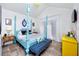 The main bedroom features a four poster bed, unique flooring, and bright pops of color at 4925 16Th N Ave, St Petersburg, FL 33710