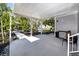 Covered patio featuring a walkway, storage, and comfortable seating, ideal for enjoying the outdoors at 4925 16Th N Ave, St Petersburg, FL 33710