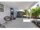 Covered patio area with a modern chair and exterior storage, offering functional outdoor living space at 4925 16Th N Ave, St Petersburg, FL 33710