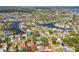 Drone shot displays a waterfront neighborhood with pools, and lush landscaping highlighting the property lines at 5050 Venetian Ne Blvd, St Petersburg, FL 33703
