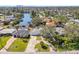 Aerial view showcases waterfront homes with boat docks and lush landscaping along a serene canal at 5050 Venetian Ne Blvd, St Petersburg, FL 33703