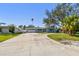 Charming single-story home with a well-manicured lawn and long driveway at 5050 Venetian Ne Blvd, St Petersburg, FL 33703