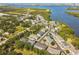Breathtaking aerial view of a waterfront residential neighborhood nestled by a lake with access to the bay at 520 Wheaton Trent Pl, Tampa, FL 33619
