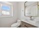 Stylish powder room featuring a modern vanity with white marble countertop and a gold mirror at 520 Wheaton Trent Pl, Tampa, FL 33619