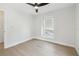 Neutral bedroom with hardwood floors and lots of natural light at 520 Wheaton Trent Pl, Tampa, FL 33619