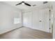 Well-lit bedroom with hard wood flooring, and a closet at 520 Wheaton Trent Pl, Tampa, FL 33619