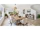 Bright dining room featuring an open layout, contemporary decor, and beautiful wood floors, perfect for entertaining at 520 Wheaton Trent Pl, Tampa, FL 33619