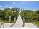 Waterfront dock with greenery, offering access to scenic views at 520 Wheaton Trent Pl, Tampa, FL 33619