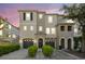 Charming townhome featuring a well-manicured lawn, attached garage, and welcoming front entrance, perfect for comfortable living at 520 Wheaton Trent Pl, Tampa, FL 33619