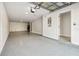 Spacious garage with ample room for parking and storage, featuring a durable epoxy floor at 520 Wheaton Trent Pl, Tampa, FL 33619