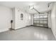 Clean garage with an automatic door opener, ready for vehicles and storage solutions at 520 Wheaton Trent Pl, Tampa, FL 33619