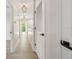 Upstairs hallway with wood floors and good lighting at 520 Wheaton Trent Pl, Tampa, FL 33619