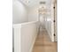Upper hallway featuring hardwood floors, modern lighting, and clean lines at 520 Wheaton Trent Pl, Tampa, FL 33619