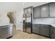 Kitchen featuring stainless steel refrigerator and gray cabinets with white countertops, offering modern amenities at 520 Wheaton Trent Pl, Tampa, FL 33619
