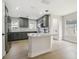 Bright kitchen featuring stainless steel appliances, a large island, and modern finishes at 520 Wheaton Trent Pl, Tampa, FL 33619