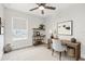 Cozy office space with a wooden desk, shelves, and a comfortable chair by the window at 520 Wheaton Trent Pl, Tampa, FL 33619