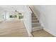 A well-lit staircase enhances the appeal of this home, showcasing the transition to the upper level at 520 Wheaton Trent Pl, Tampa, FL 33619