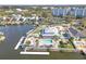 Beautiful waterfront home with a pool, boat dock, and lush landscaping surrounded by mature palms at 5722 Biscayne Ct # 308, New Port Richey, FL 34652