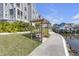A relaxing bench swing is nestled along the canal at 5722 Biscayne Ct # 308, New Port Richey, FL 34652