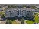 Lovely condo building featuring a well-maintained green lawn, ample parking, and boat docks at 5722 Biscayne Ct # 308, New Port Richey, FL 34652