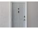 Unit 308 featuring a front door equipped with a smart doorbell and keypad entry system at 5722 Biscayne Ct # 308, New Port Richey, FL 34652